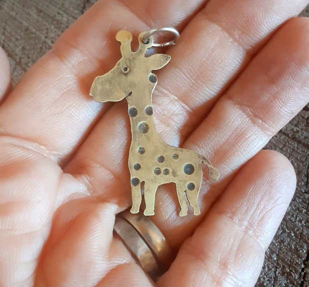 Handcrafted custom girrafe in brass to create a pendant necklace