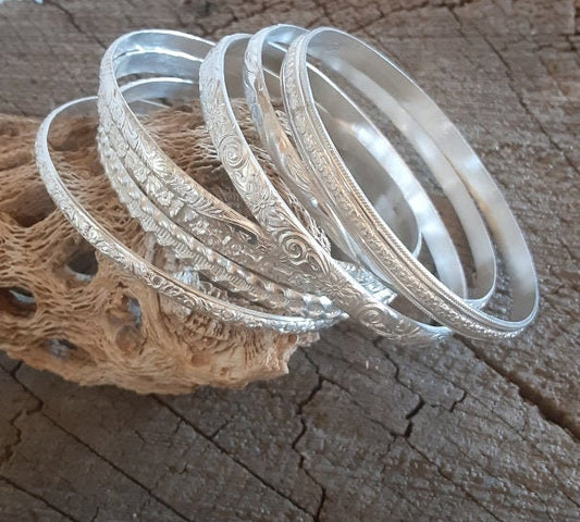 Stackable sterling silver bangles in a set without patina
