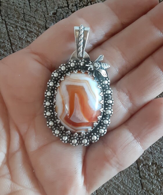Red lace agate pendant with flowers and bee