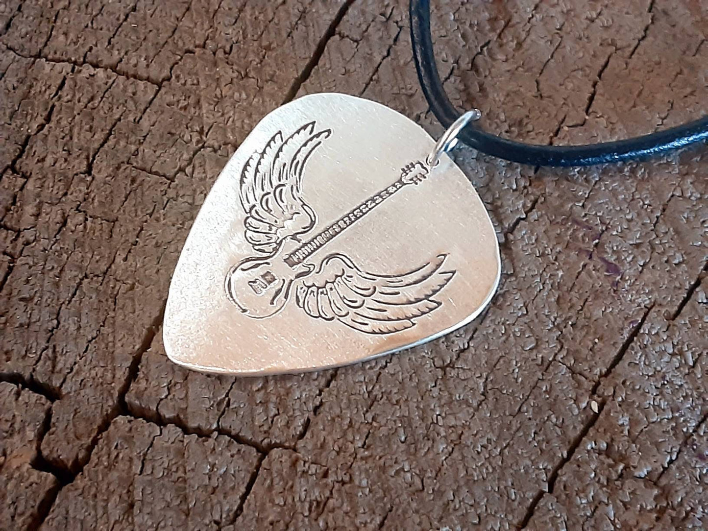 Sterling Silver winged guitar on guitar pick necklace