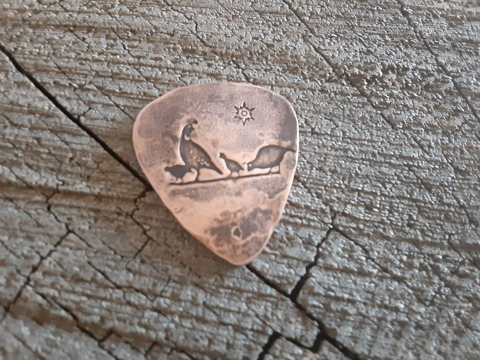 Desert quail on copper guitar pick