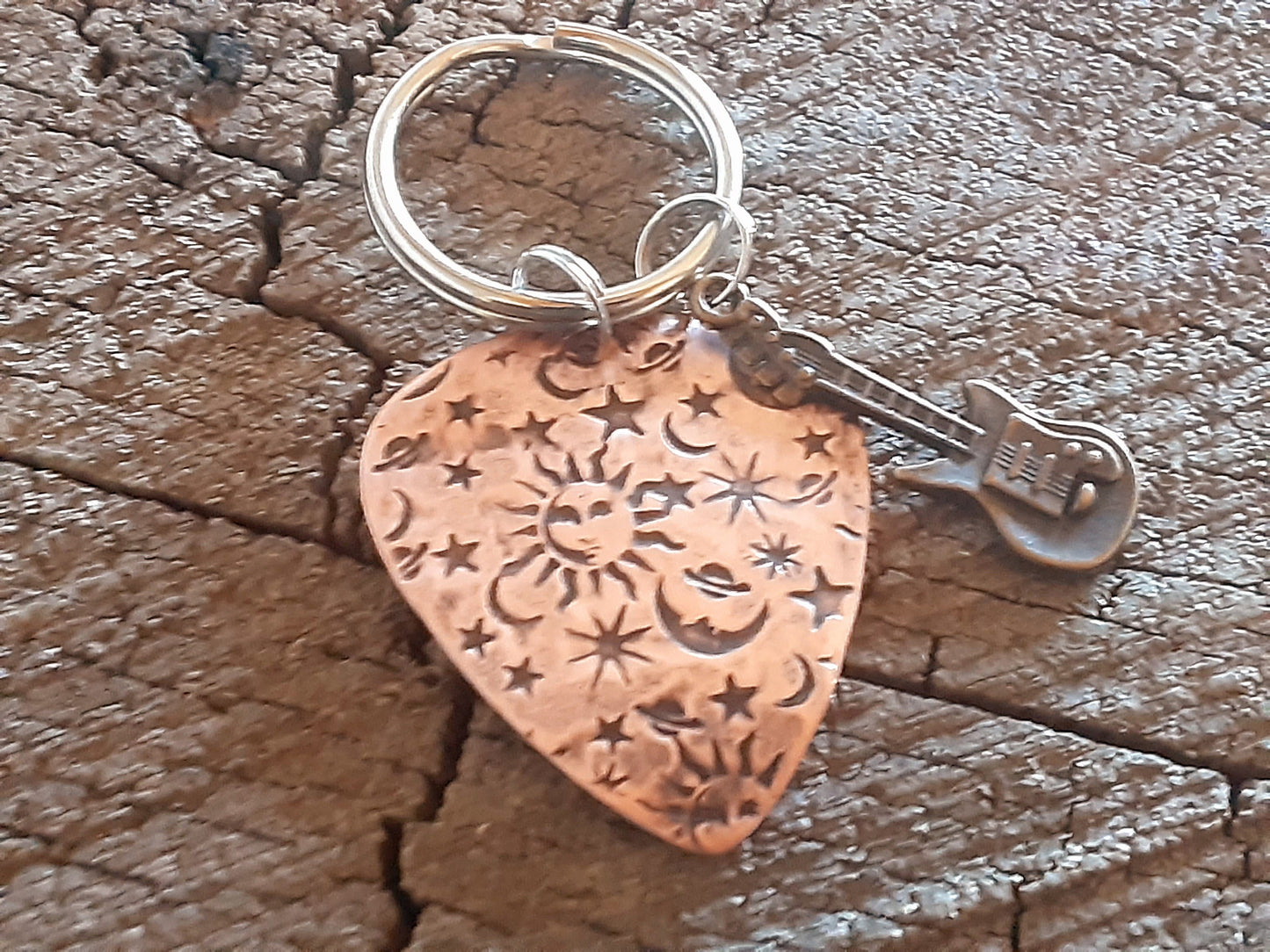 Copper guitar pick keychain with sun moon and stars and small brass guitar charm