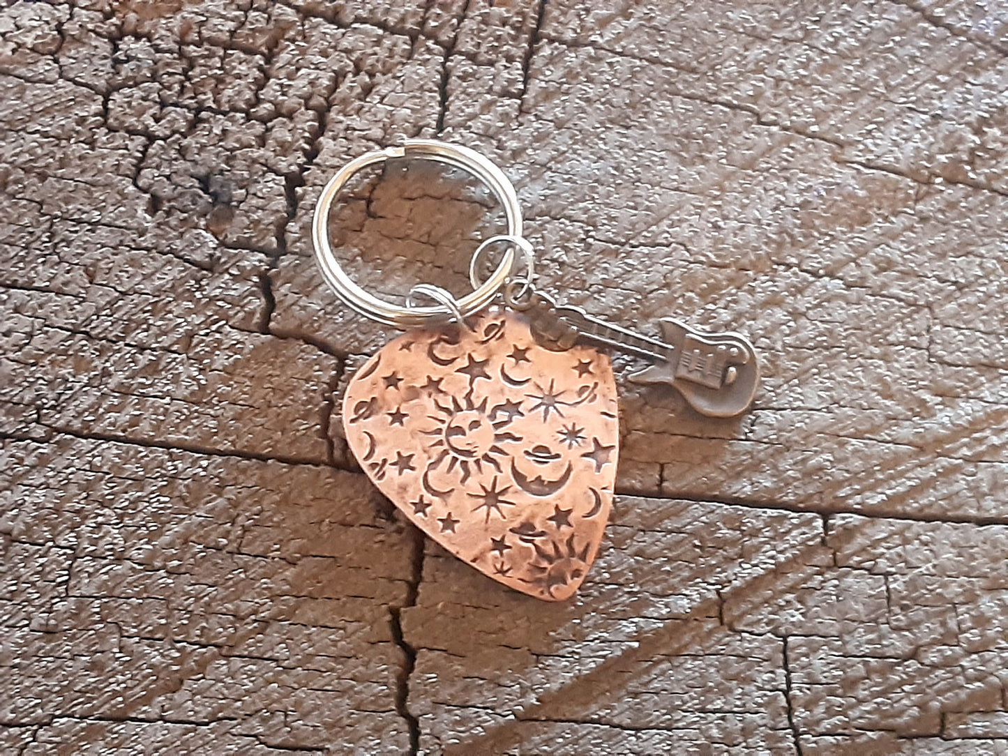 Copper guitar pick keychain with sun moon and stars and small brass guitar charm