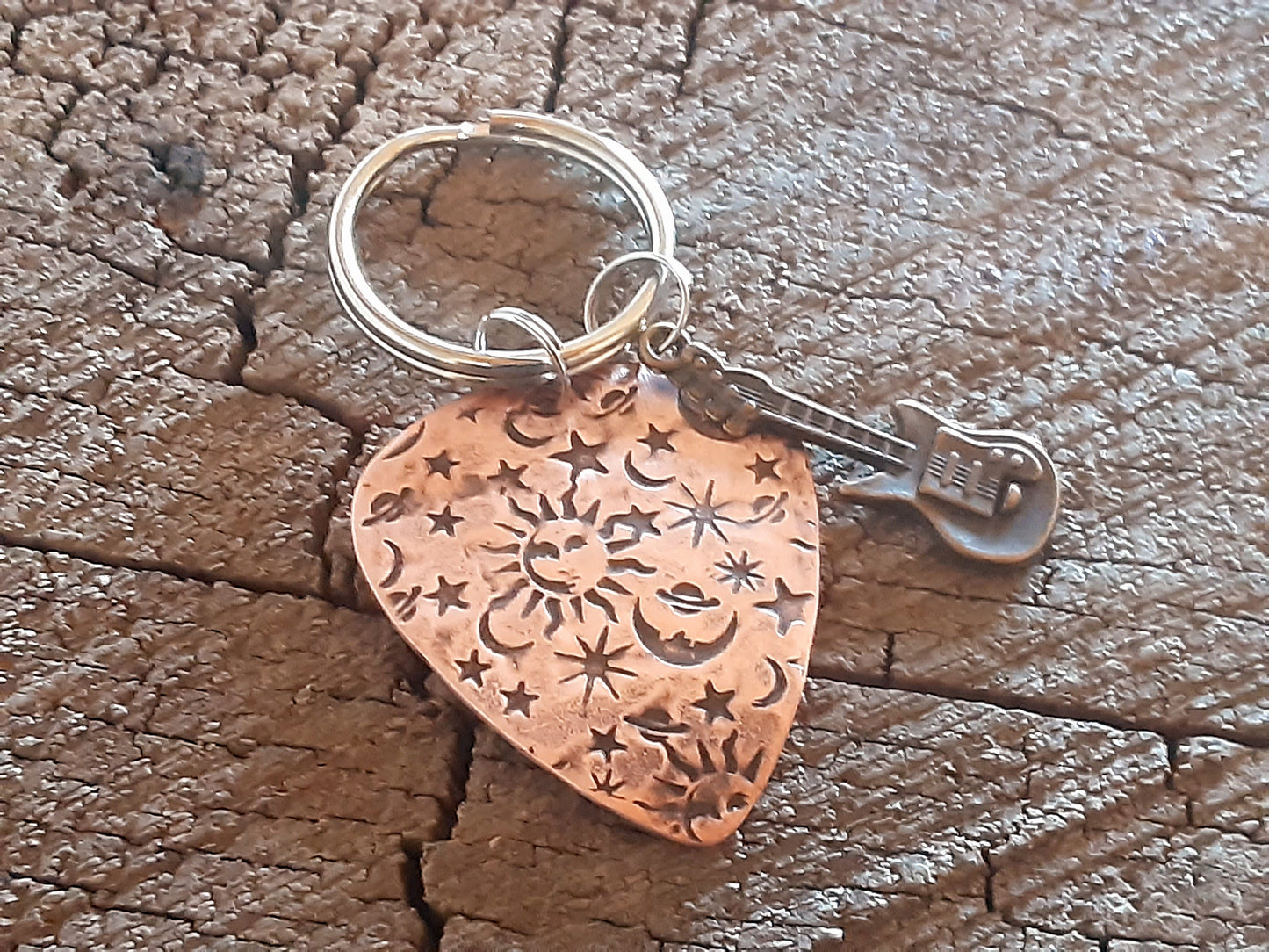 Copper guitar pick keychain with sun moon and stars and small brass guitar charm