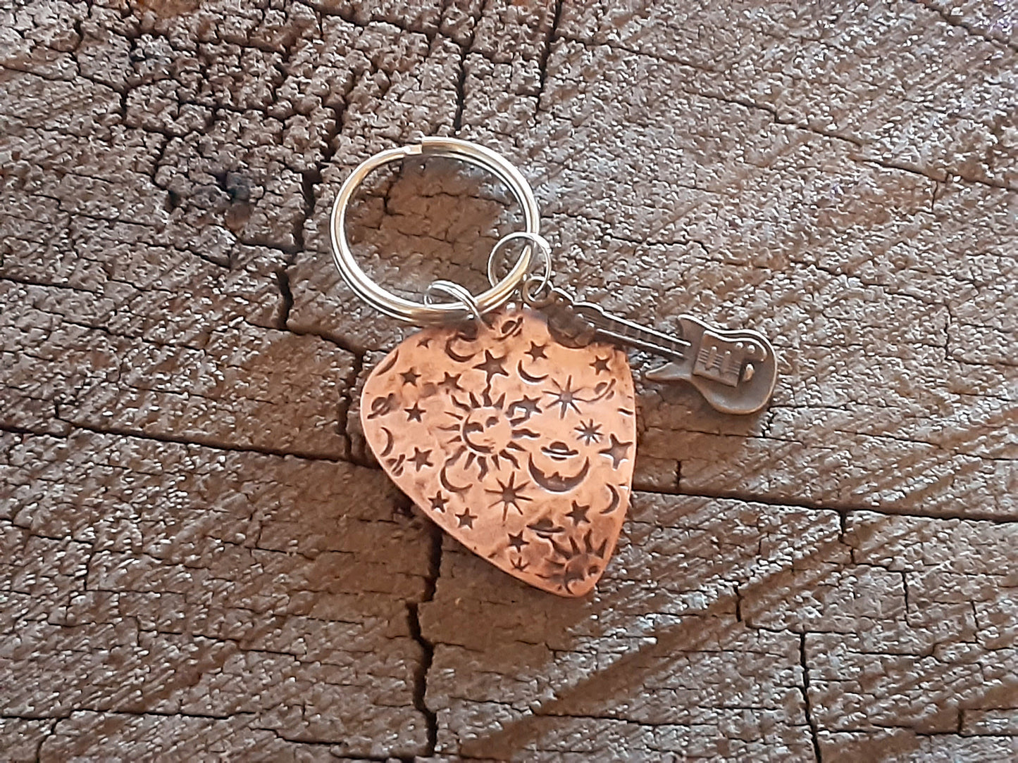 Copper guitar pick keychain with sun moon and stars and small brass guitar charm