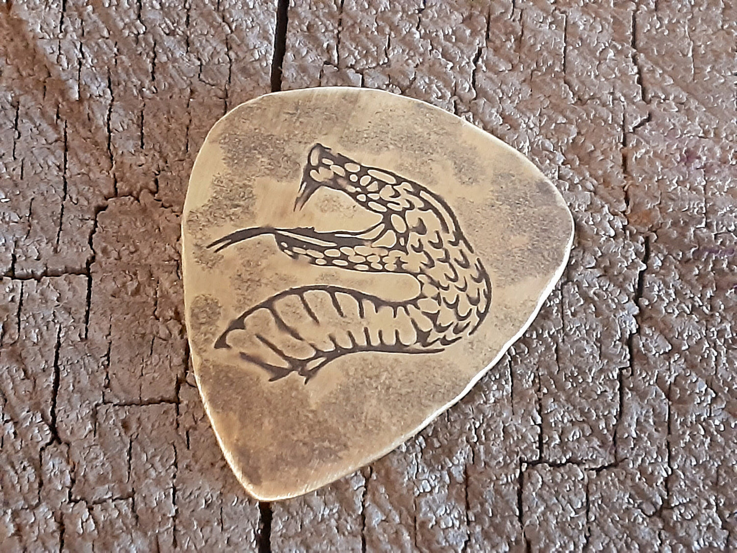 brass guitar pick - playable with snake head
