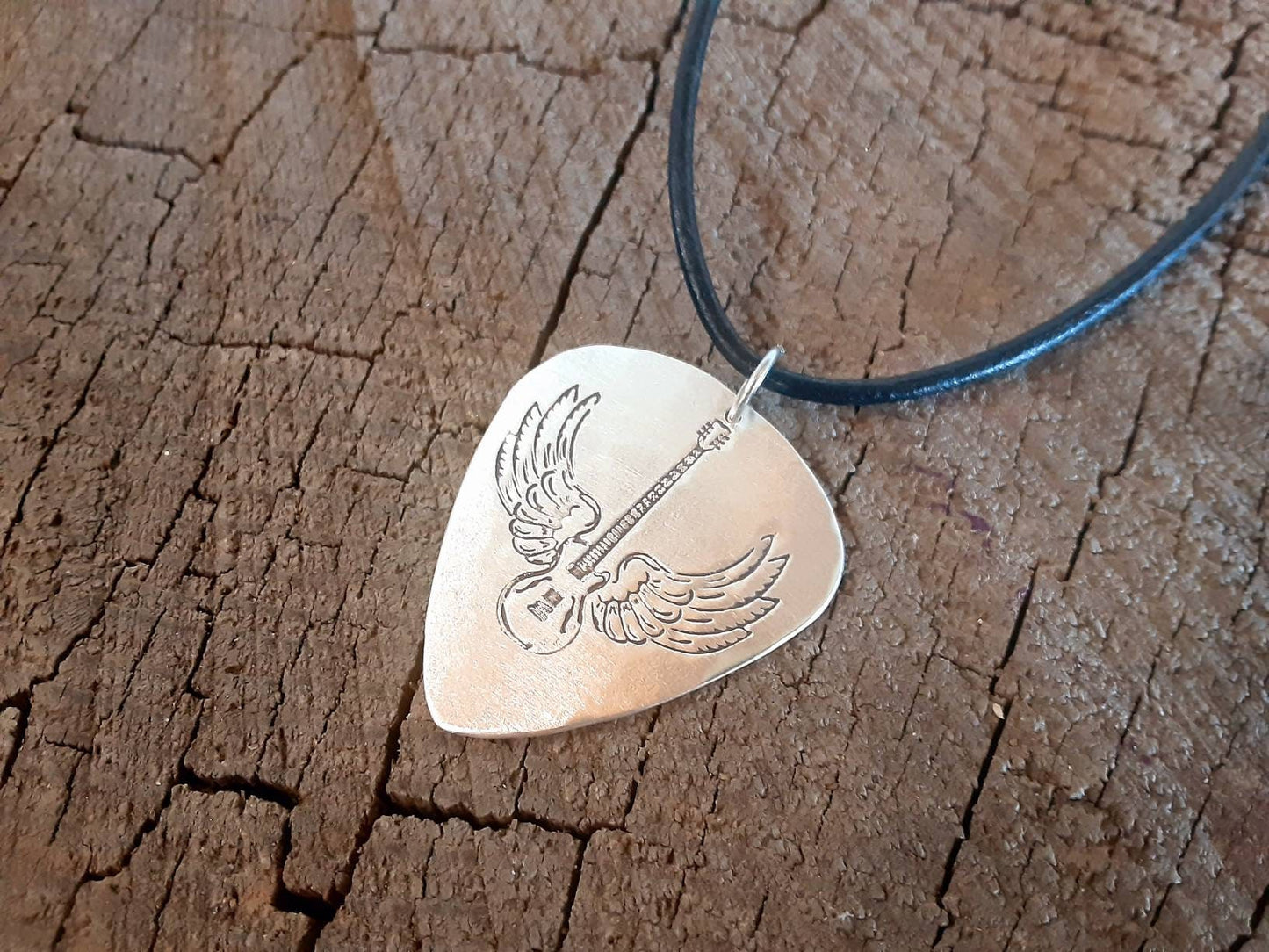 Sterling Silver winged guitar on guitar pick necklace