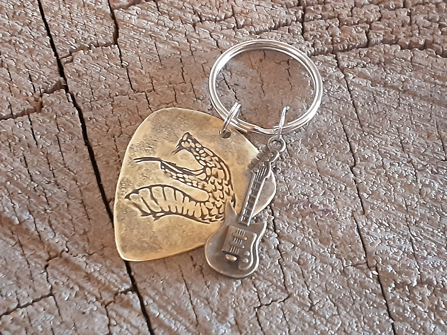 Snake design on brass guitar pick key chain and a small accent guitar charm