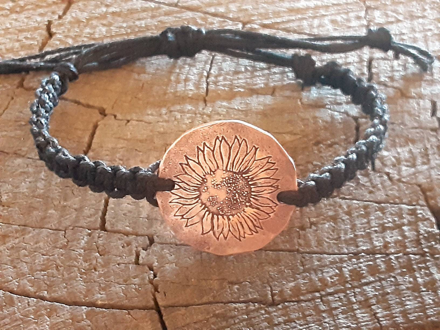 Sunflower button bracelet in black hemp with copper tag
