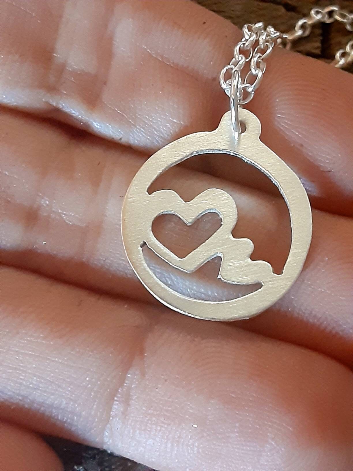 Sterling silver heart charm necklace