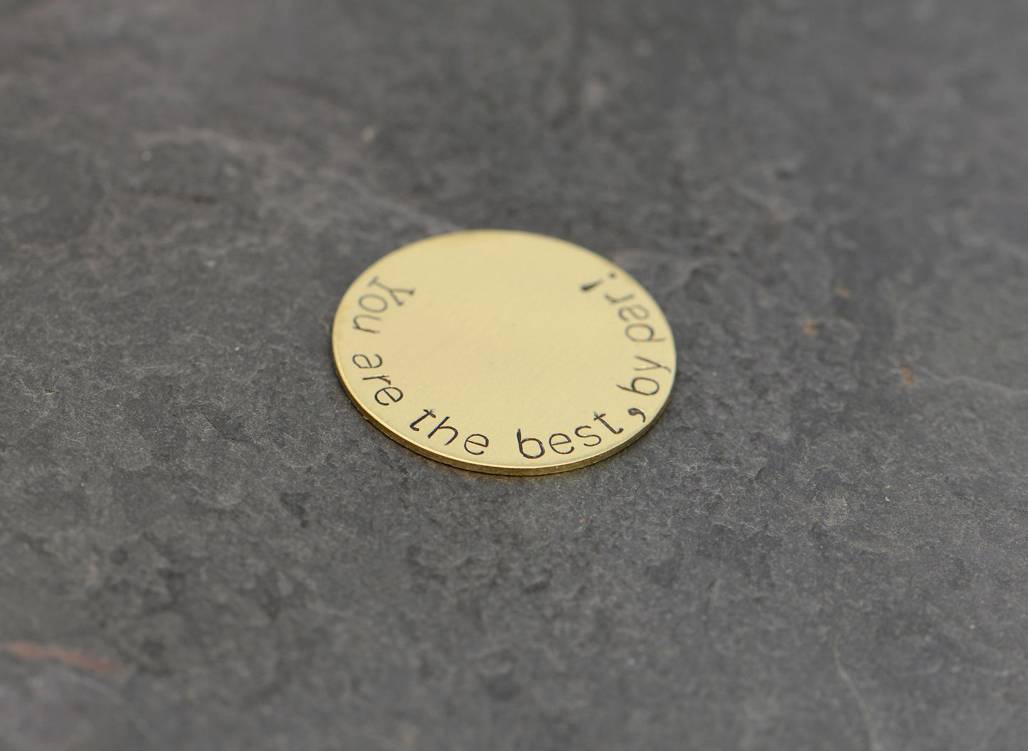 Bronze golf ball marker stamped with you are the best by par