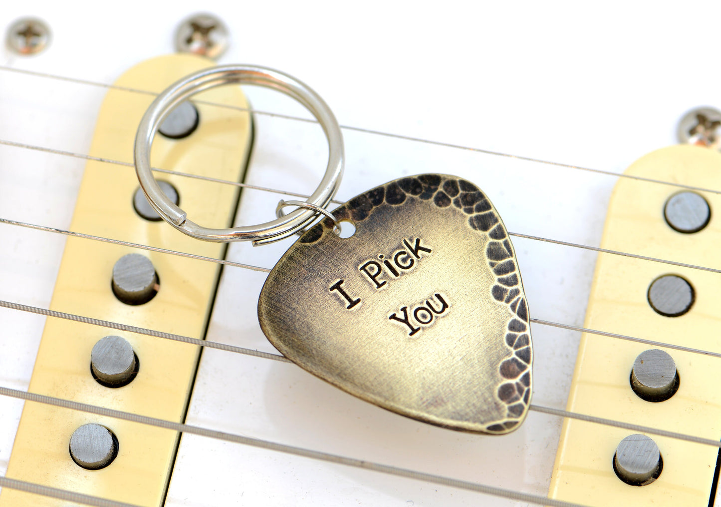 Bronze guitar pick keychain