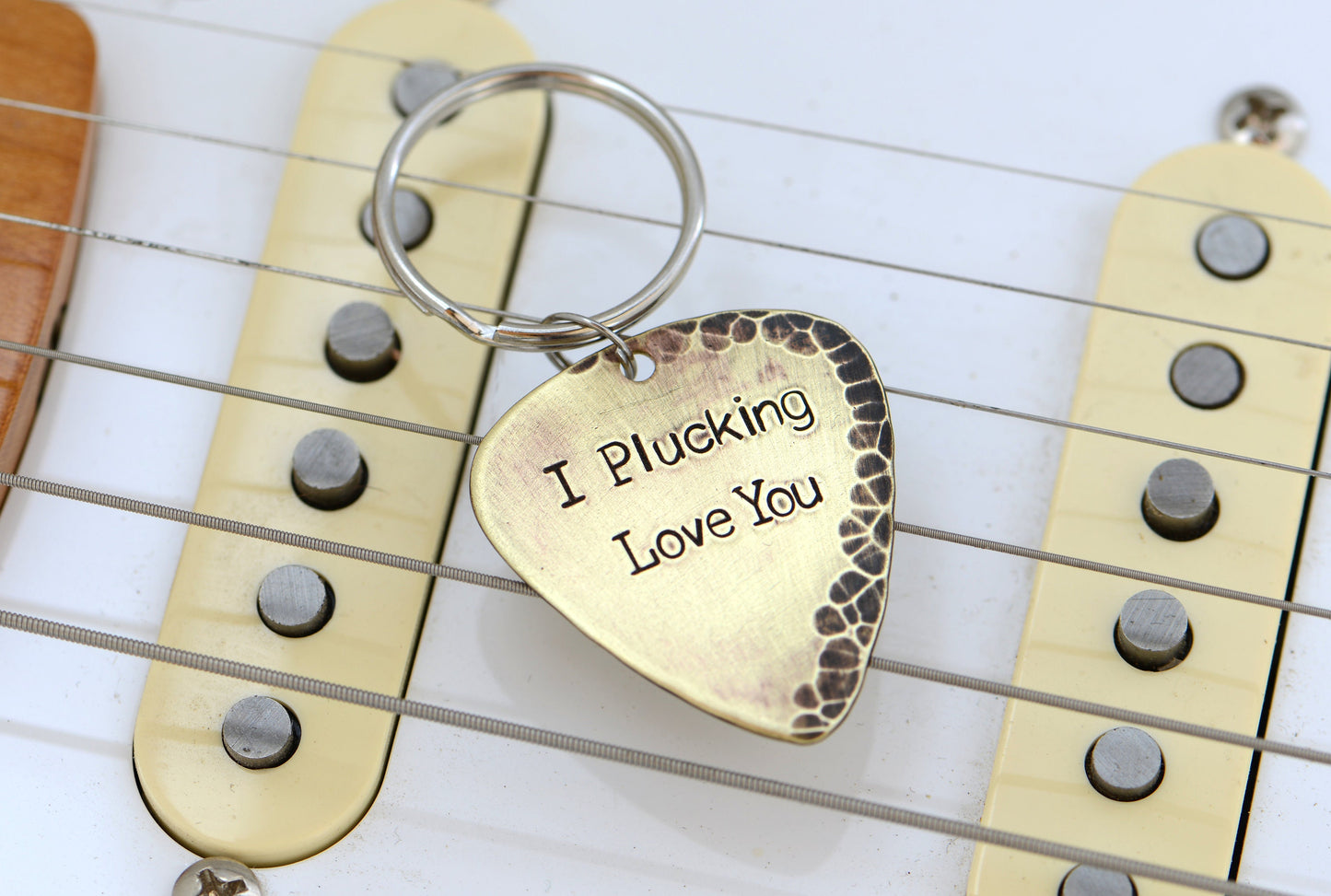 I plucking love you keychain in rustic brass with hammered finish