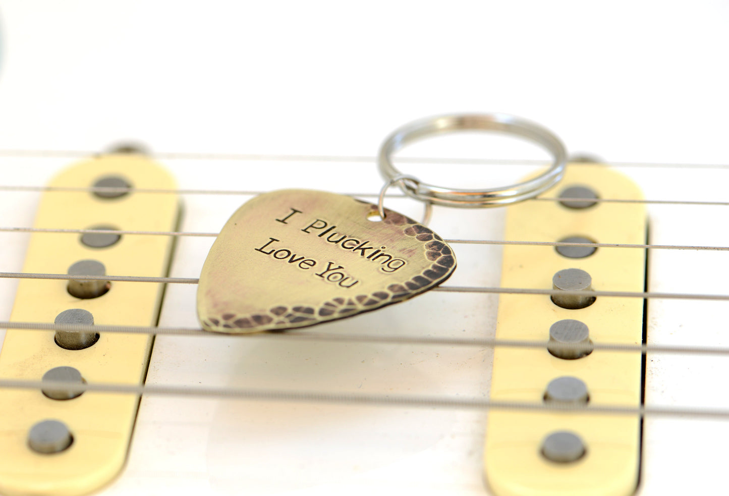 I plucking love you keychain in rustic brass with hammered finish