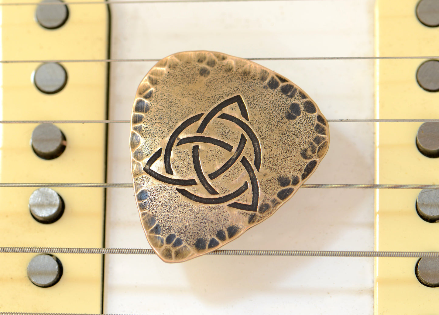 Trifecta Bronze Guitar Pick in a Celtic Trinity Knot