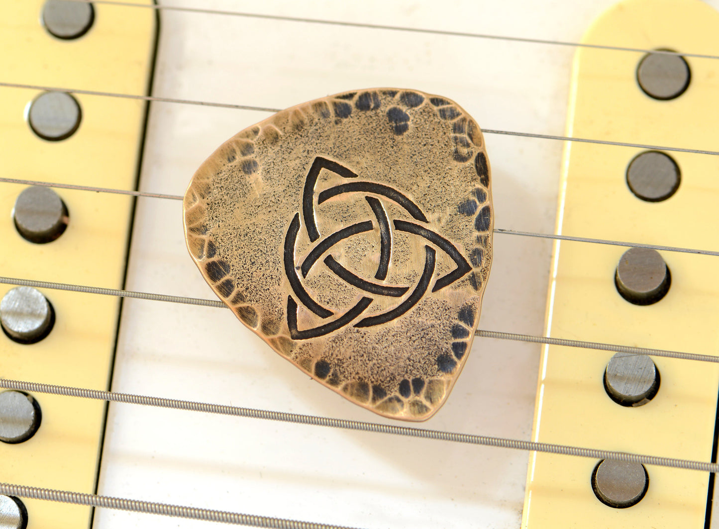 Trifecta Bronze Guitar Pick in a Celtic Trinity Knot
