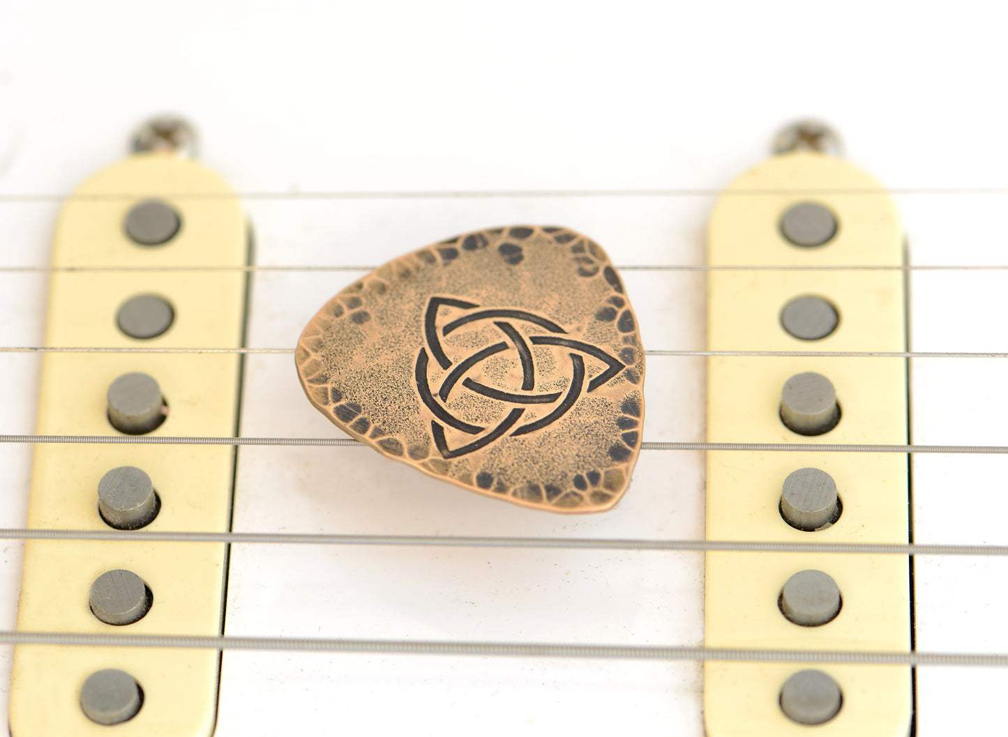 Trifecta Bronze Guitar Pick in a Celtic Trinity Knot