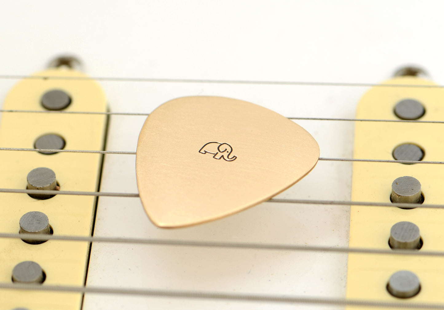 Just an Elephant on a Bronze Guitar Pick – No politics or symbolic meaning besides an Elephant on a Guitar Pick