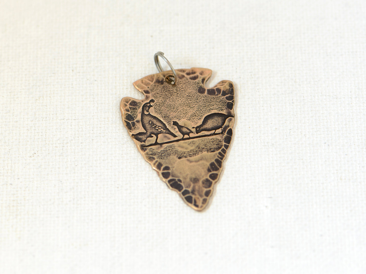 Bronze arrowhead with desert quail theme necklace
