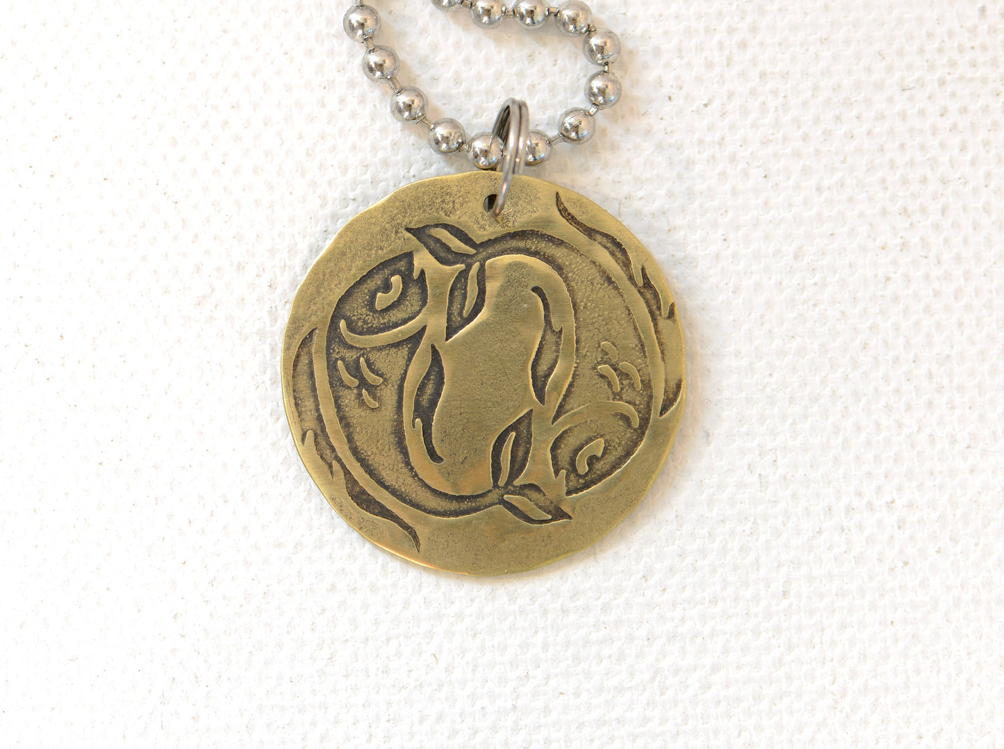Zodiac charm style necklace shown with Pisces zodiac sign but can be personalized