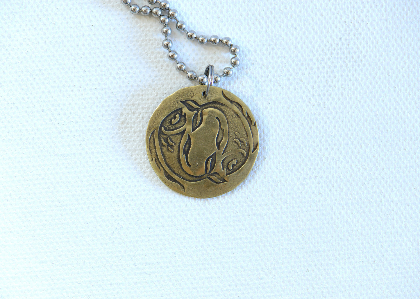 Zodiac charm style necklace shown with Pisces zodiac sign but can be personalized