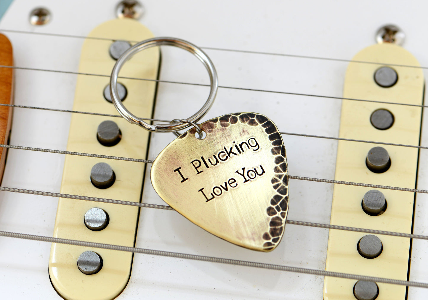 I plucking love you keychain in rustic brass with hammered finish