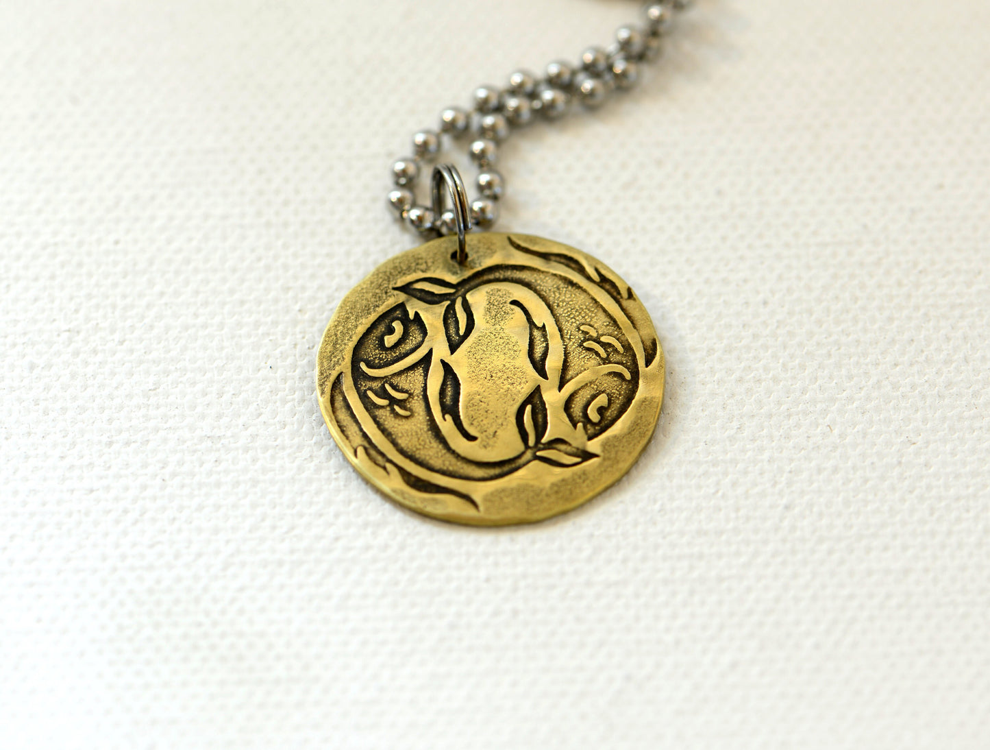 Zodiac charm style necklace shown with Pisces zodiac sign but can be personalized