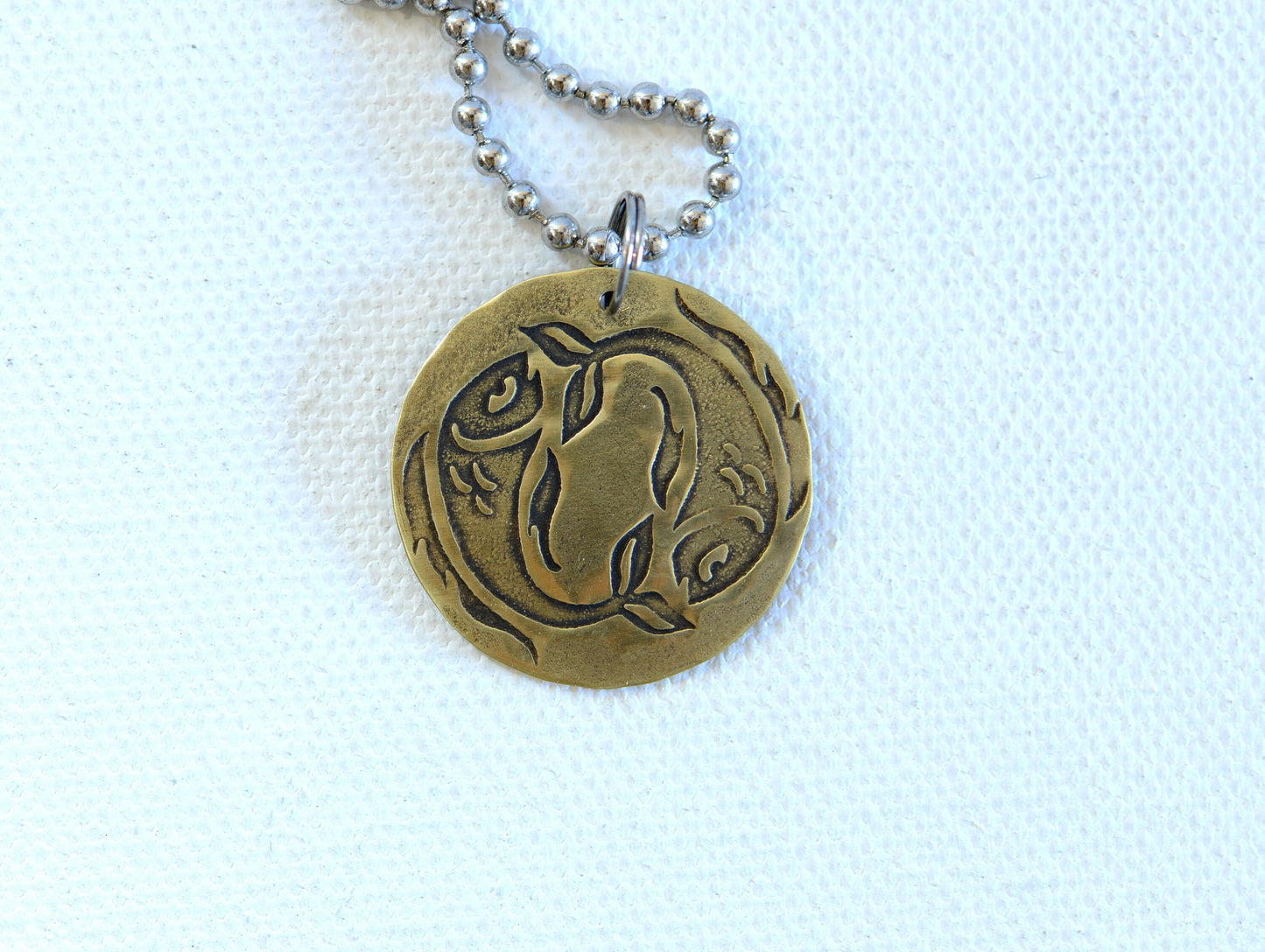 Zodiac charm style necklace shown with Pisces zodiac sign but can be personalized