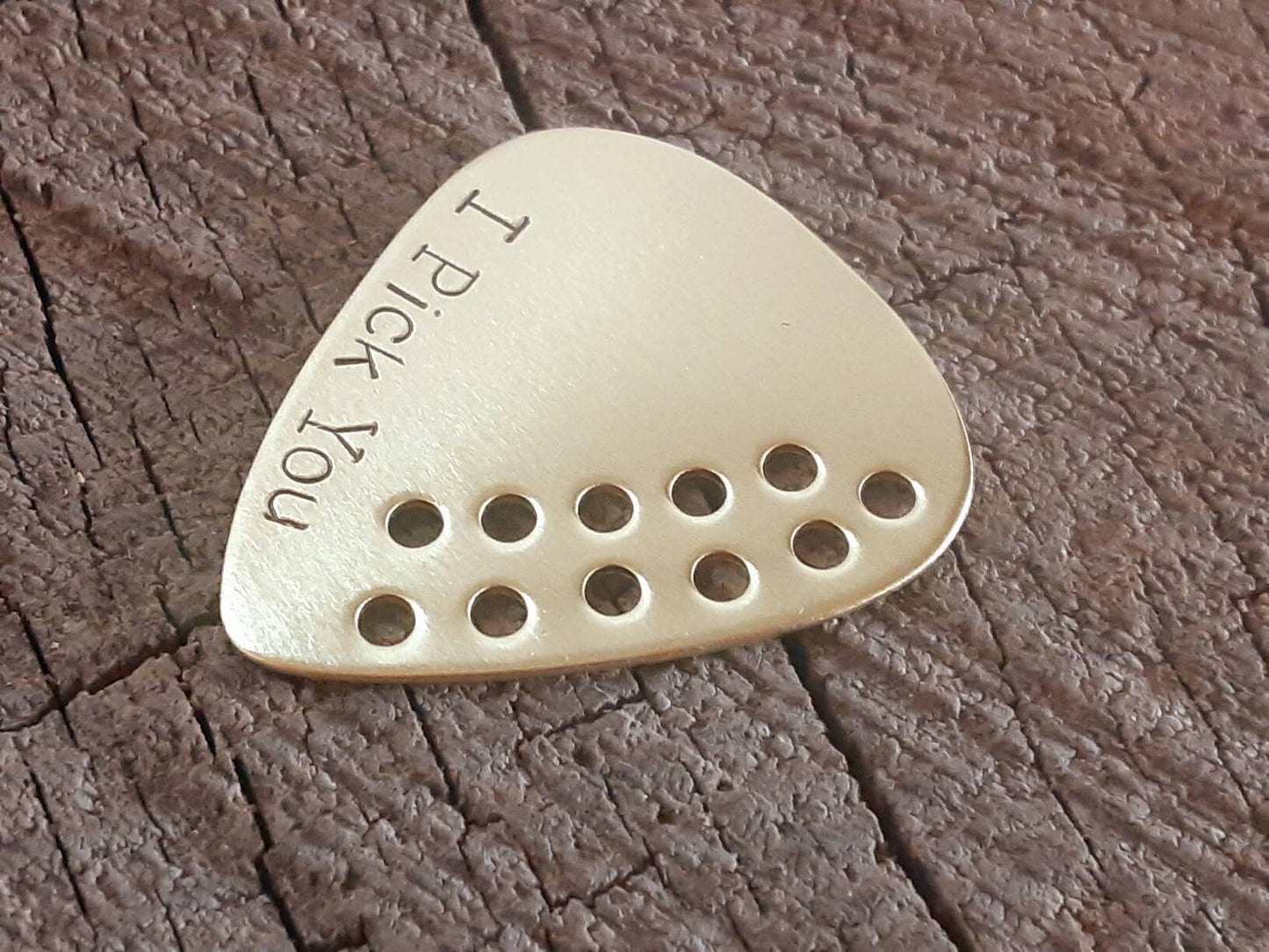 I pick you brass guitar pick with hole design