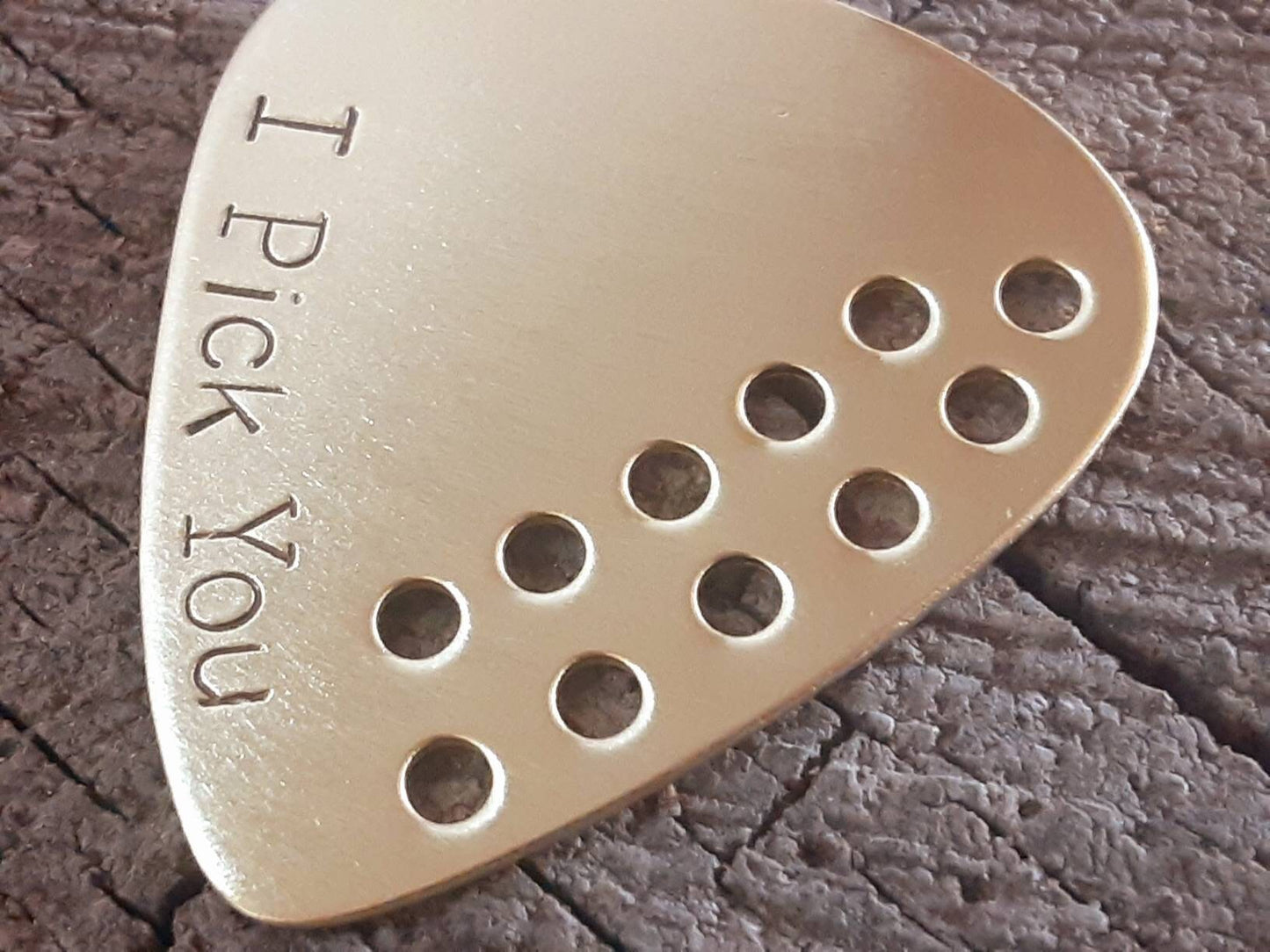 I pick you brass guitar pick with hole design