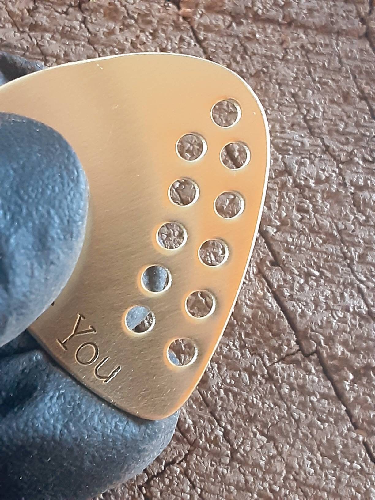 I pick you brass guitar pick with hole design