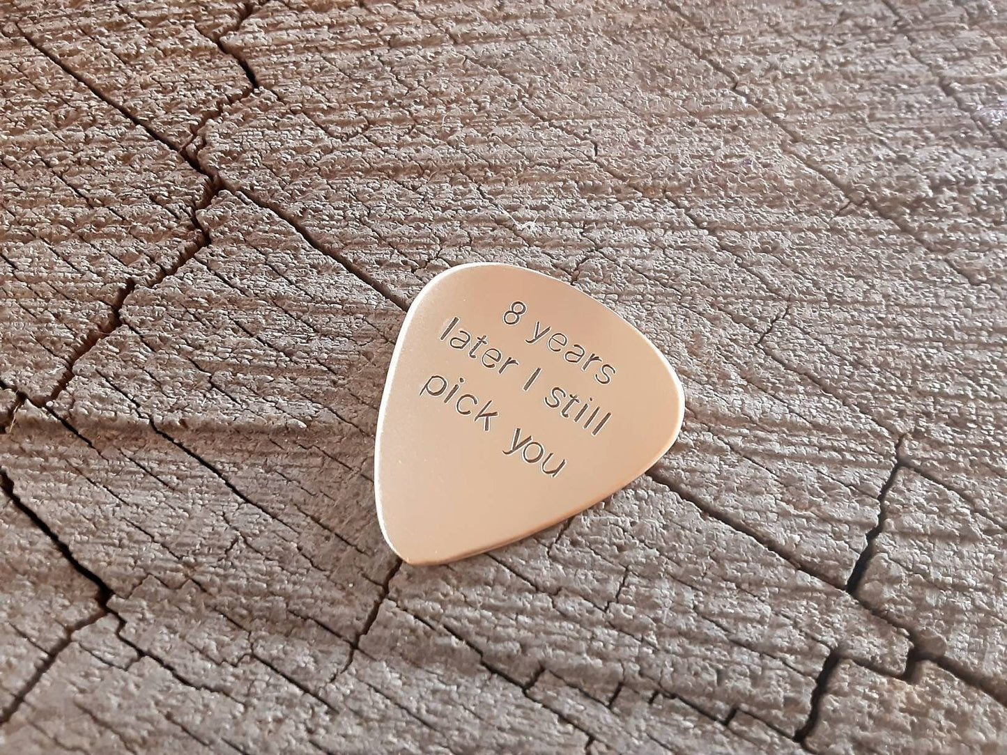 Bronze guitar pick for the 8th anniversary