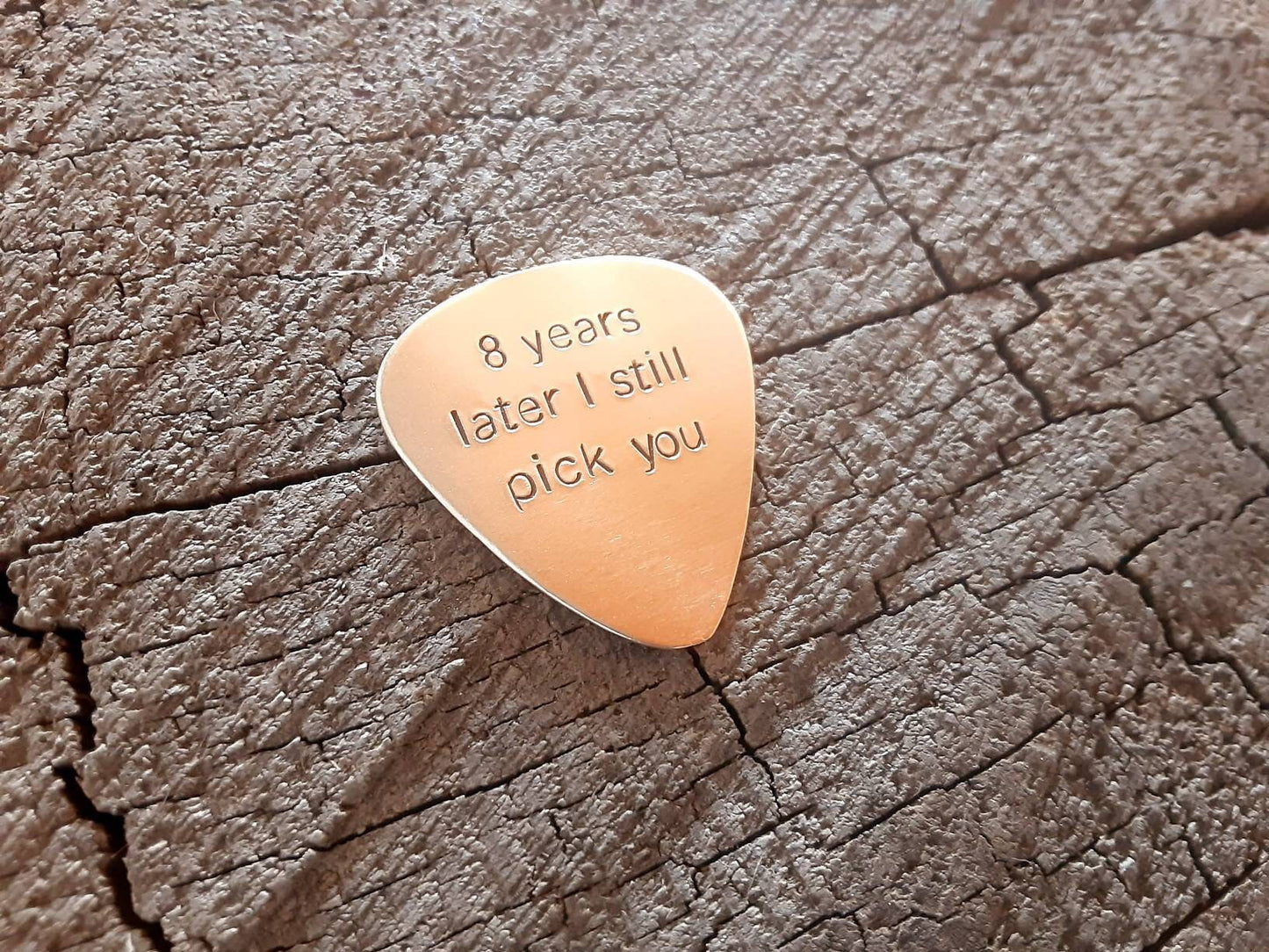 Bronze guitar pick for the 8th anniversary