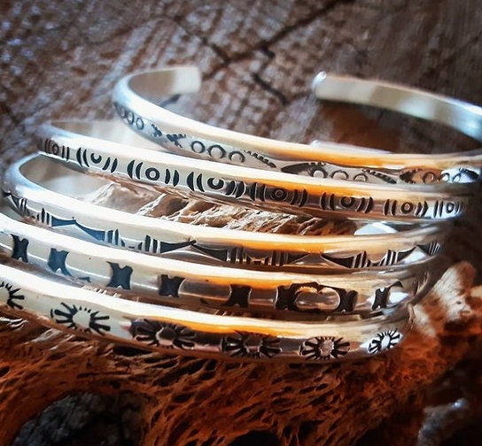 Sterling silver stacking bracelets with hand stamped patterns as singles or a set