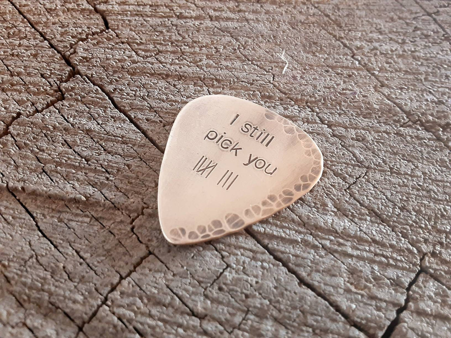 Playable guitar pick in bronze with tally marks for 8th anniversaries