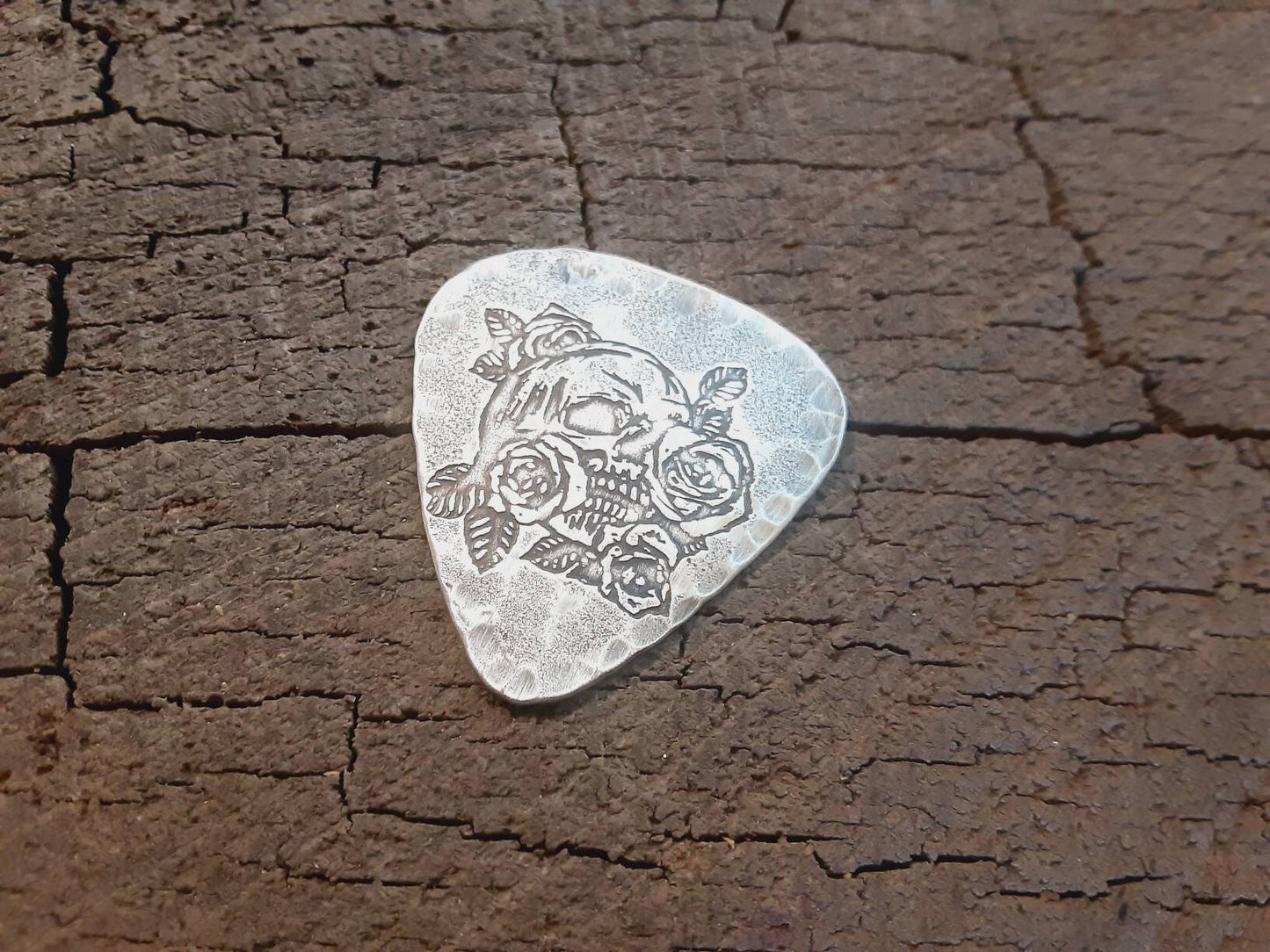 Sterling silver guitar pick with skull and roses