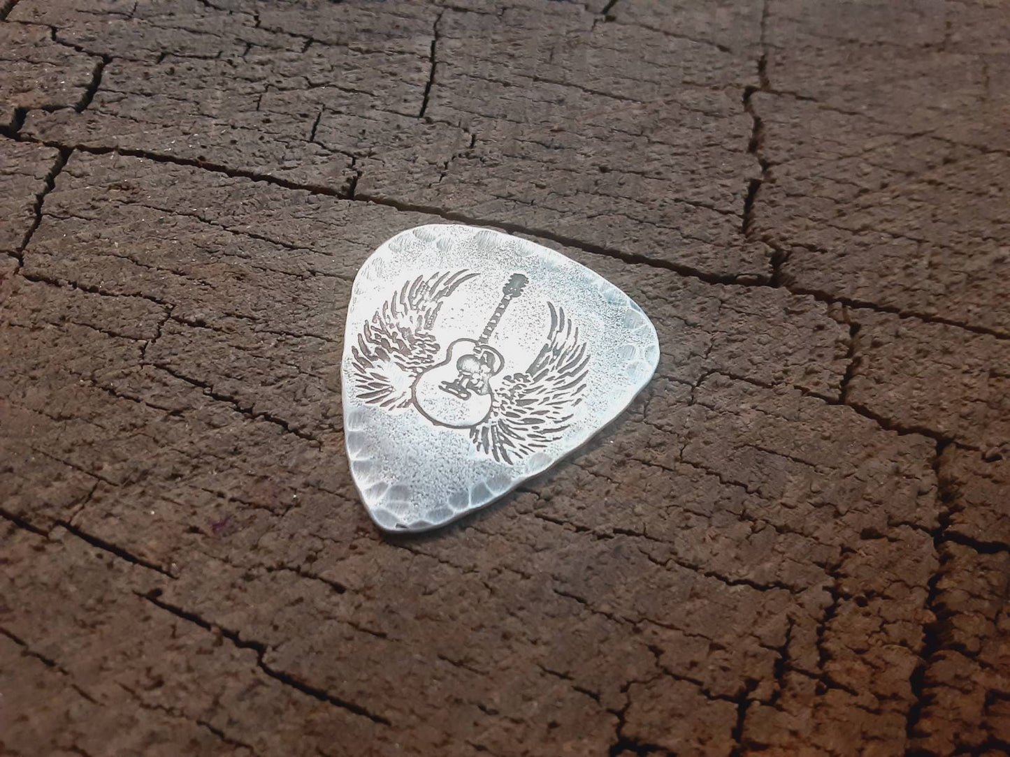 Winged guitar on hammered sterling silver guitar pick