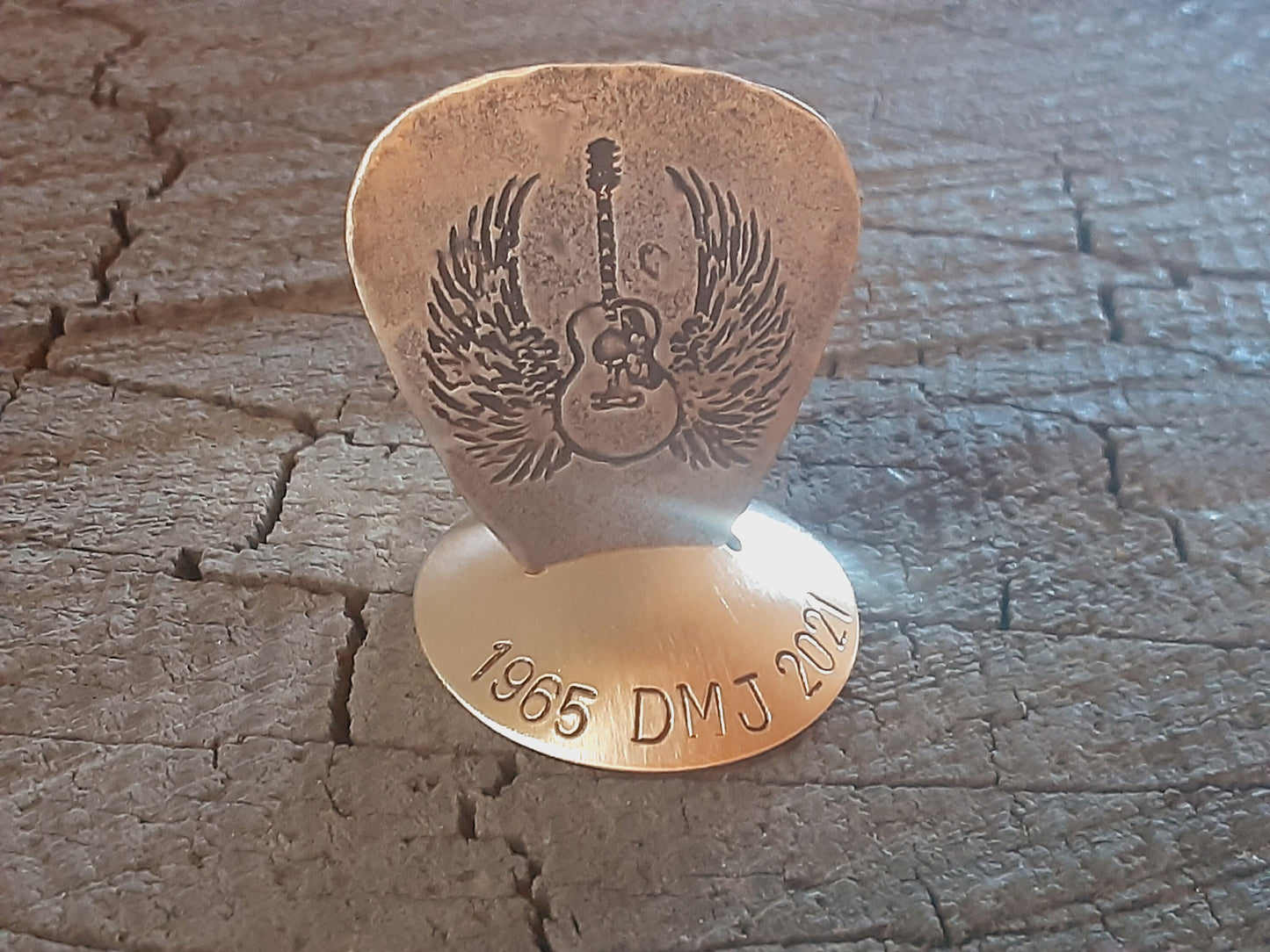 Bronze guitar pick with stand memorial