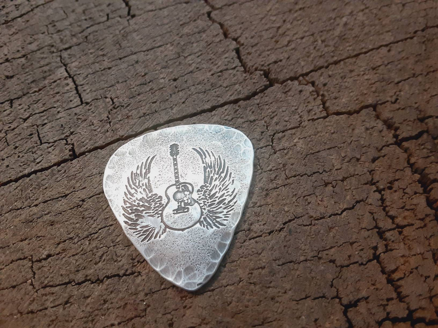 Winged guitar on hammered sterling silver guitar pick