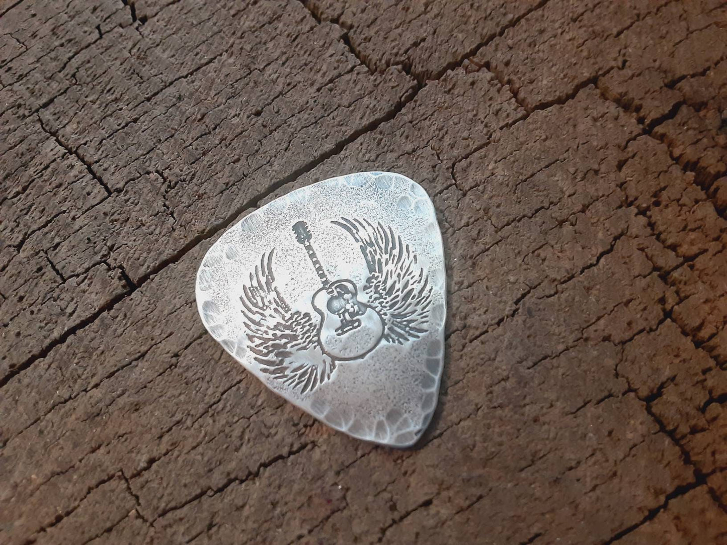 Winged guitar on hammered sterling silver guitar pick