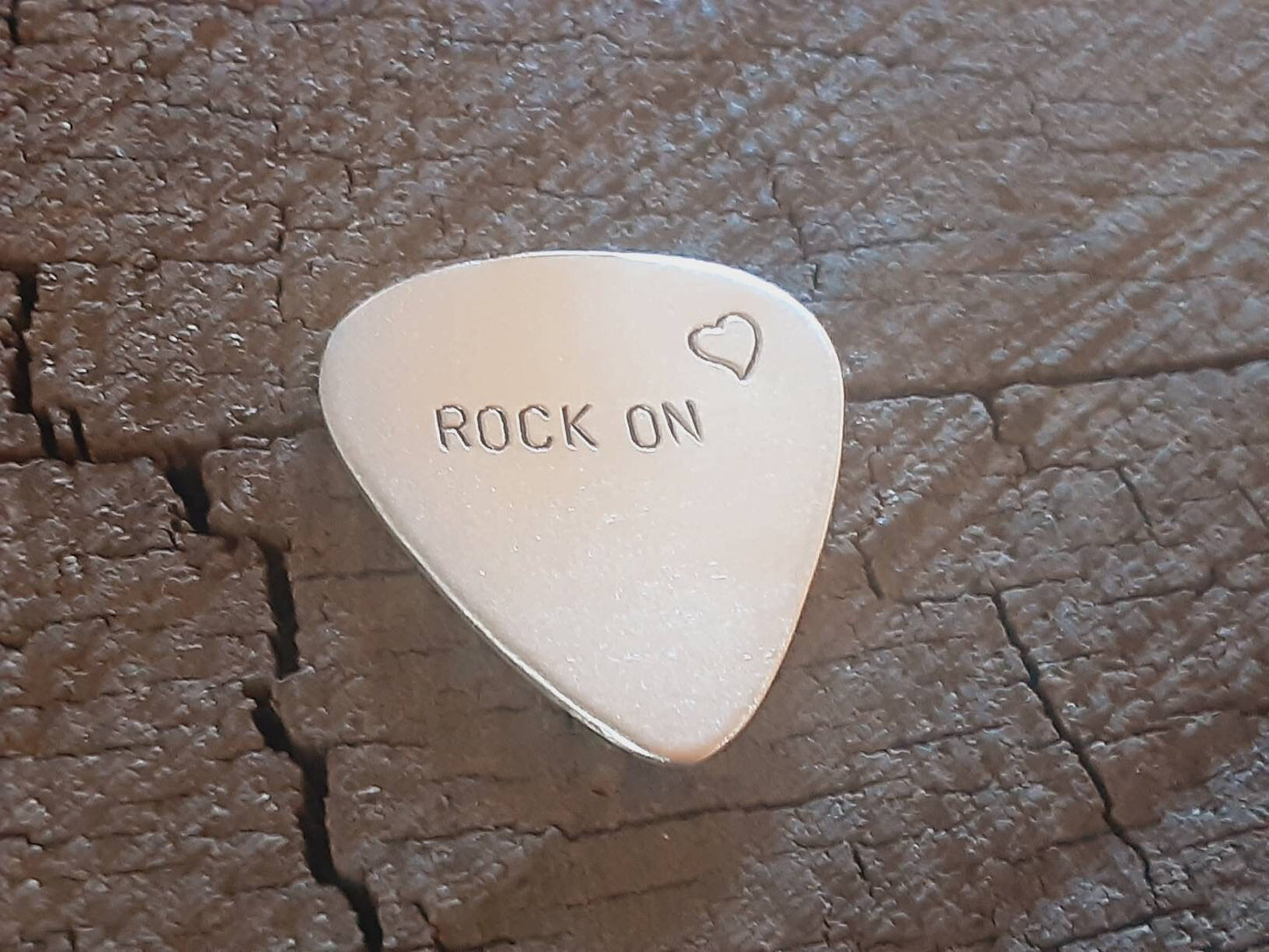 Sterling silver guitar pick - playable with rock on