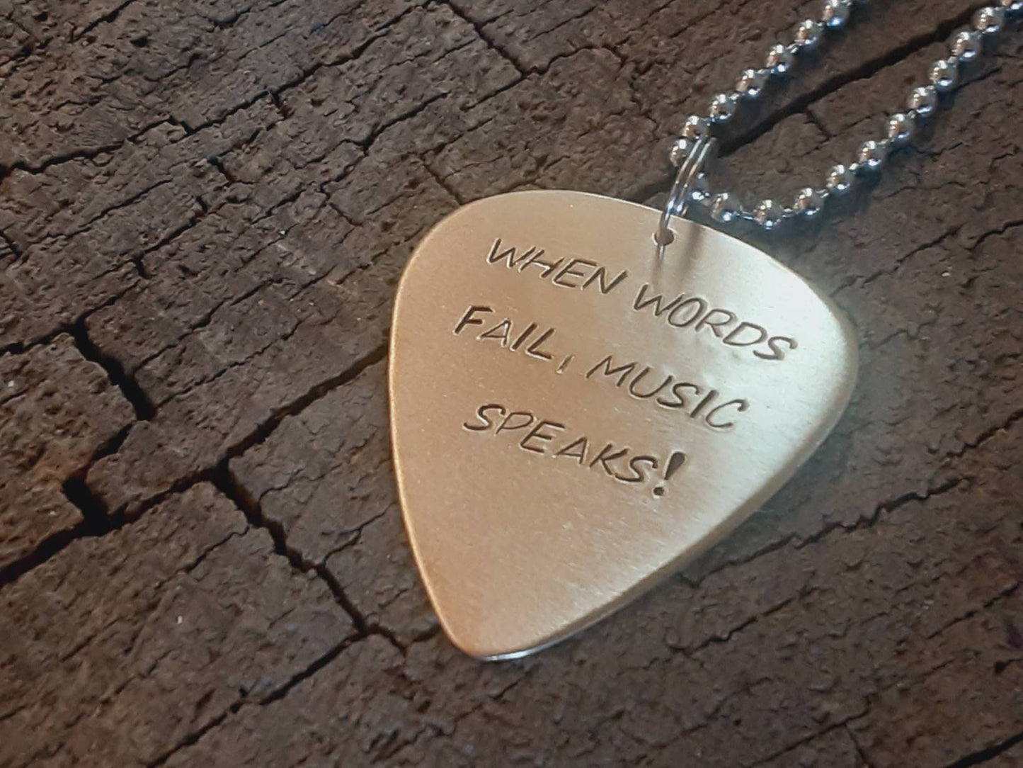 When words fail music speaks bronze necklace with guitar pick