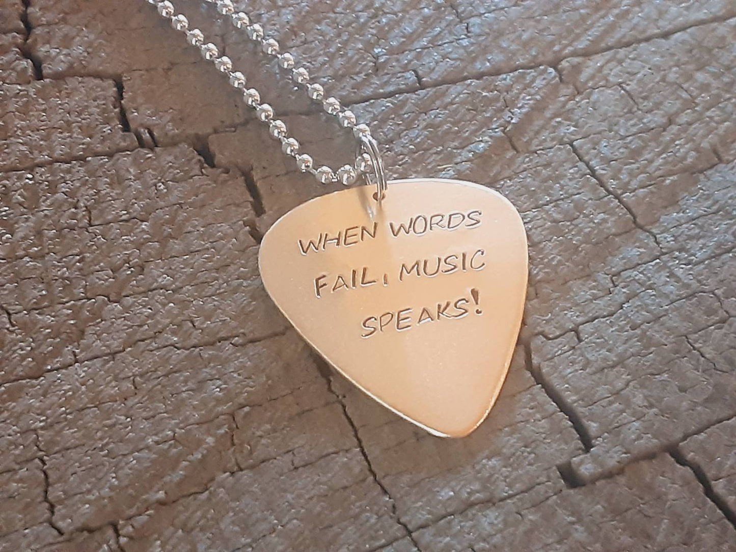 When words fail music speaks bronze necklace with guitar pick