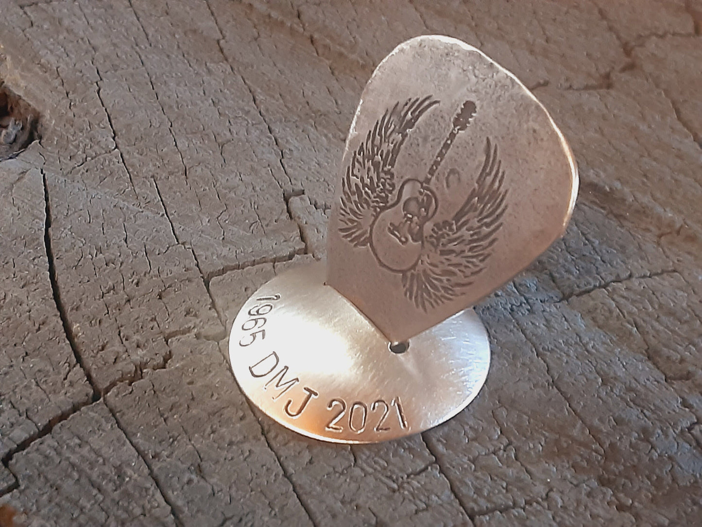 Bronze guitar pick with stand memorial
