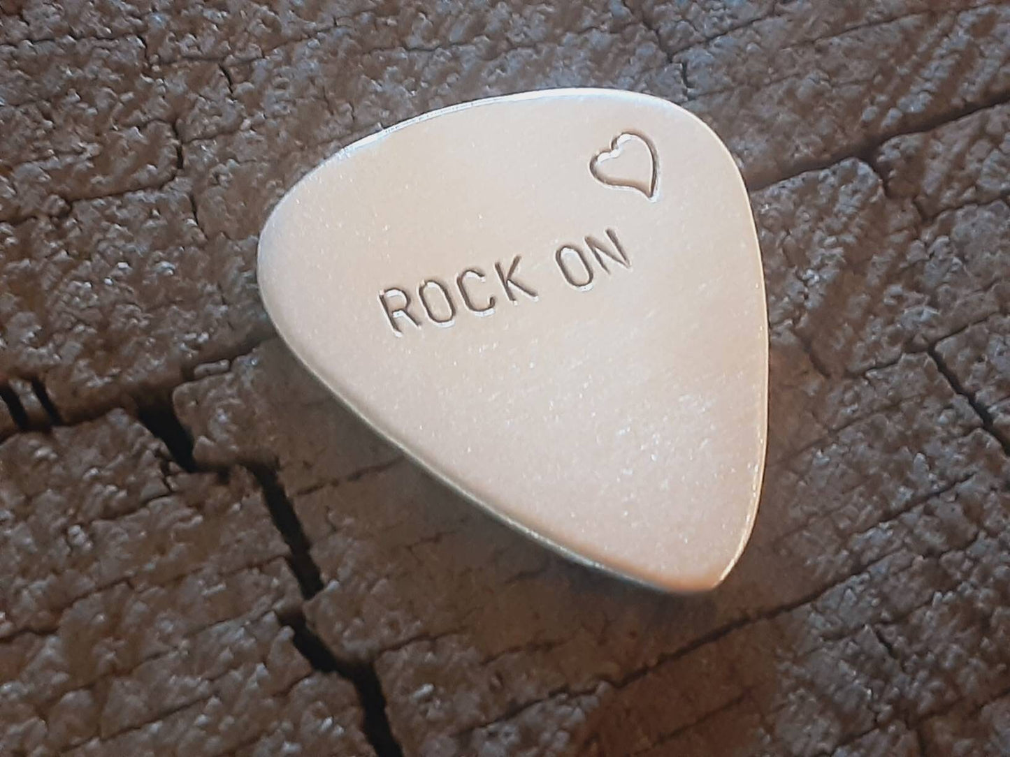 Sterling silver guitar pick - playable with rock on