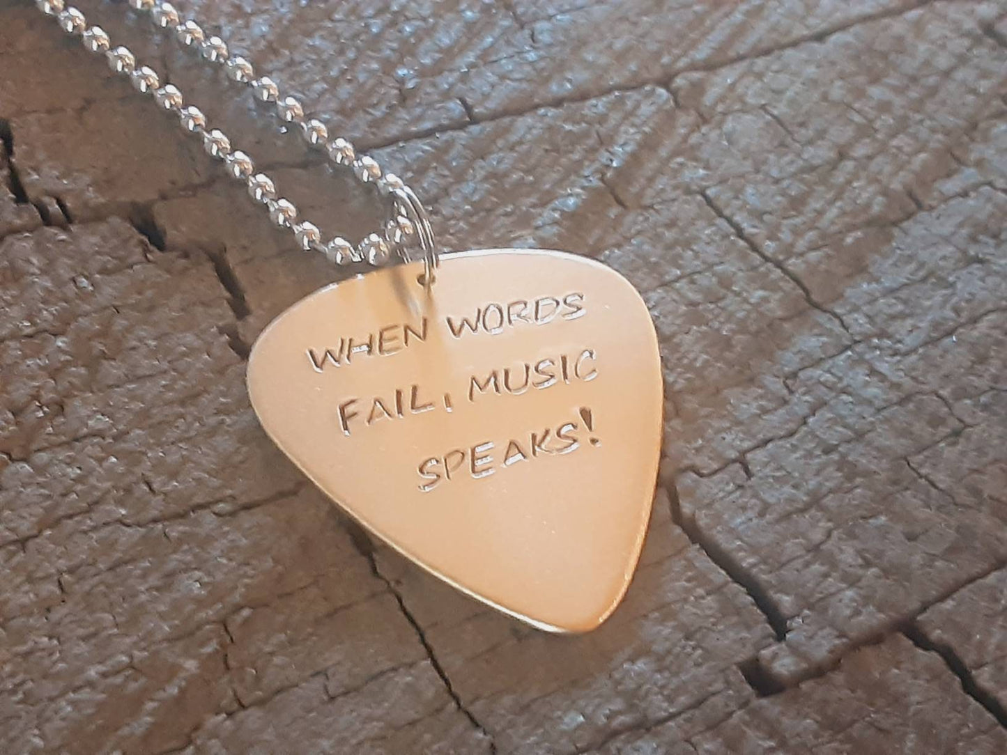 When words fail music speaks bronze necklace with guitar pick