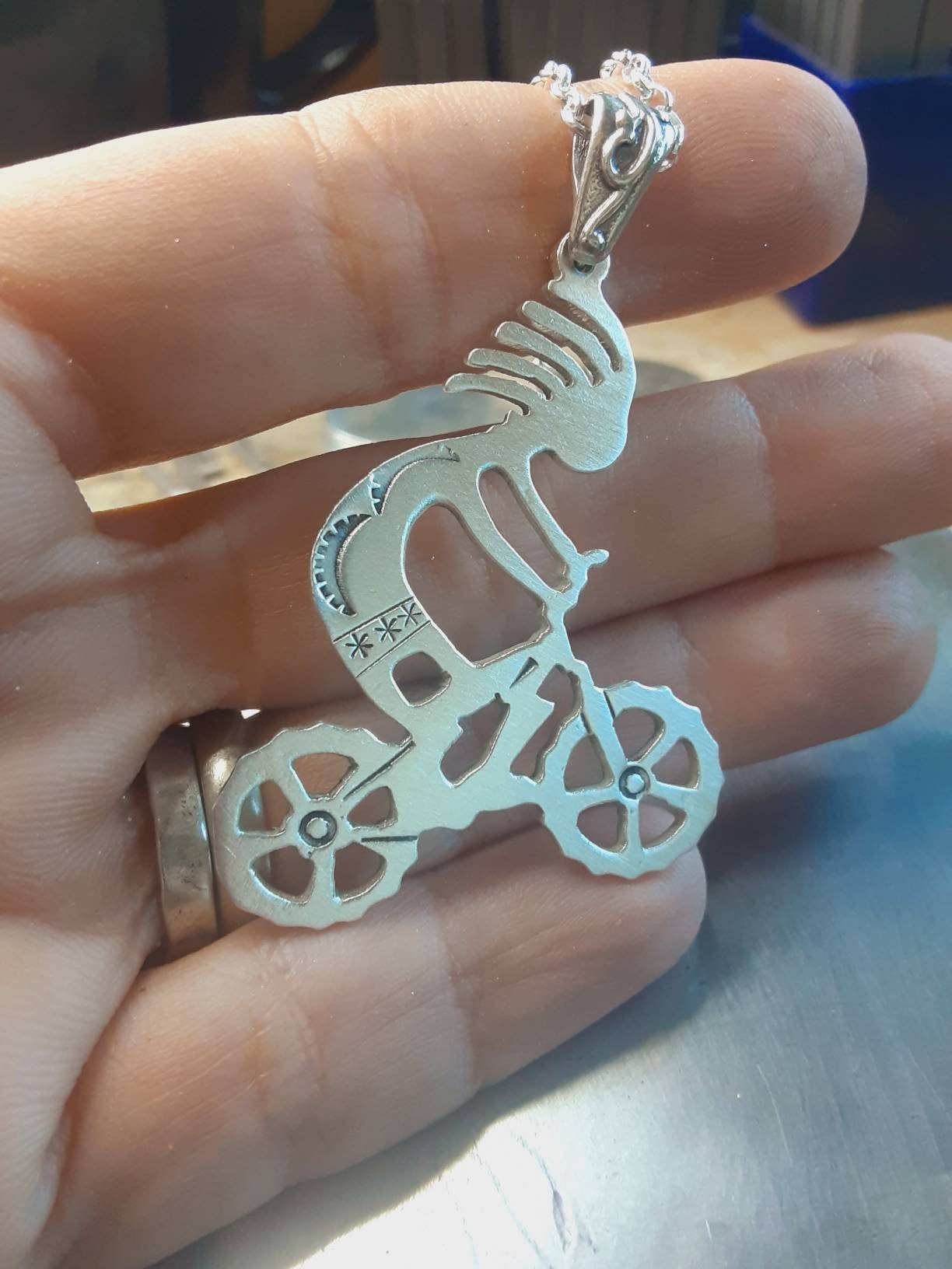 Kokopelli on mountain bike sterling silver necklace