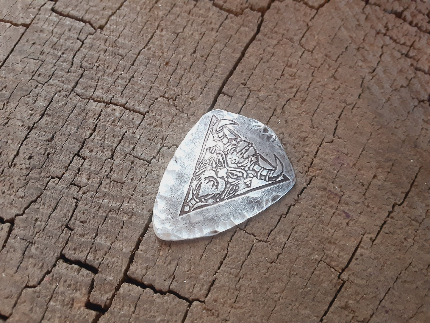 Shield shaped sterling silver guitar pick with viking theme