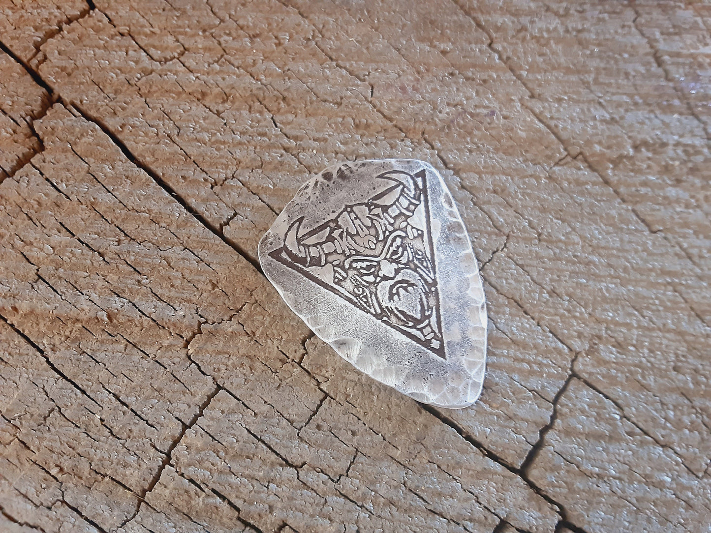 Shield shaped sterling silver guitar pick with viking theme
