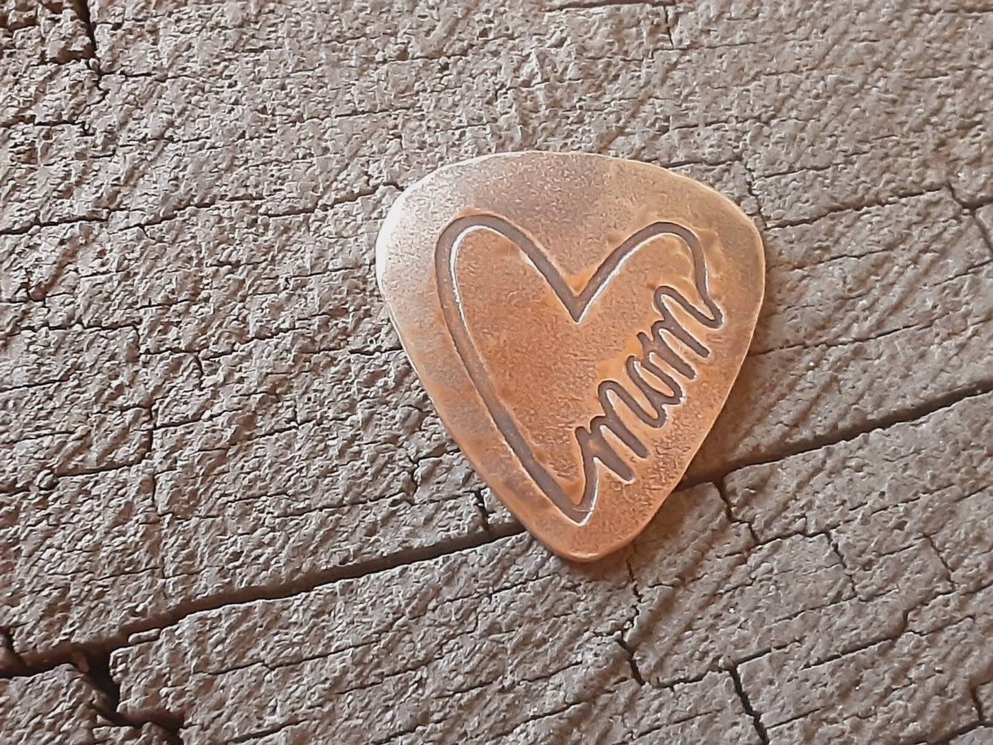 Mom guitar pick in bronze